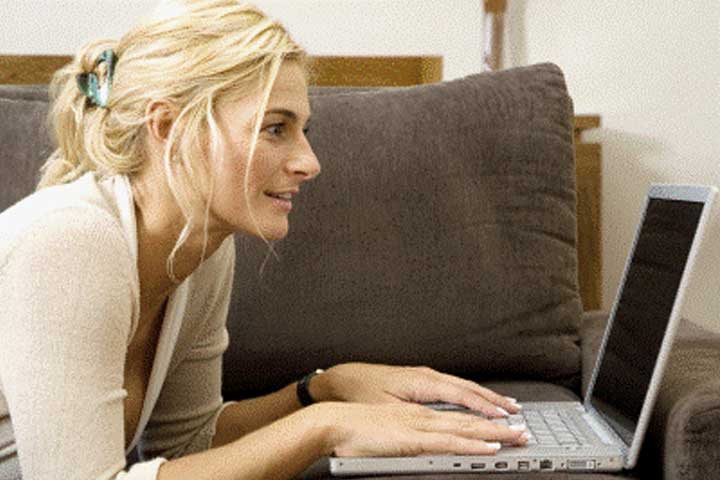 Woman using a laptop at a Gatlinburg condo.