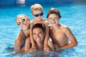 Happy family at a Gatlinburg condo with a pool.