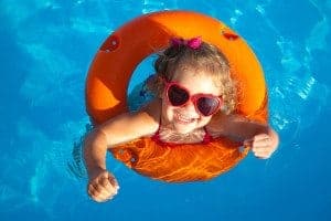 Little girl in an inner tube at a Gatlinburg condo with a pool.