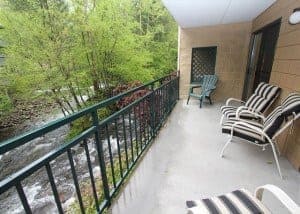 Deck overlooking the river from a 2 bedroom condo in Gatlinburg TN