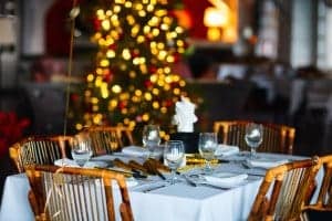 A restaurant with a glittering Christmas tree.